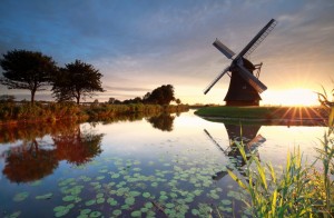 summer sunrise behind Dutch windmill, Holland