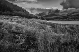 Moody image of a landscape overlooking the Talybont Reservoir, Brecon Beacons, Wales in the United Kingdom.