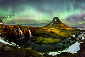 The Northern Lights dances over Mt. Kirkjufell in Iceland.