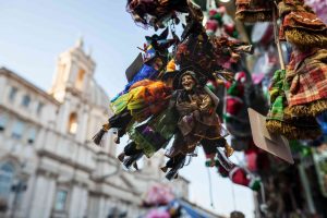 Christmas in Piazza Navona, in Rome. Vendors sells La Befana dolls throughout the season. 